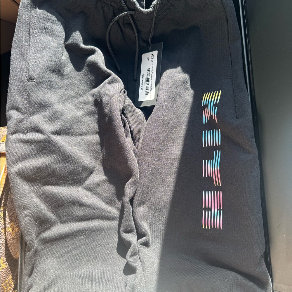 Kith Black Sweatpants with Multicolor Stripe Logo